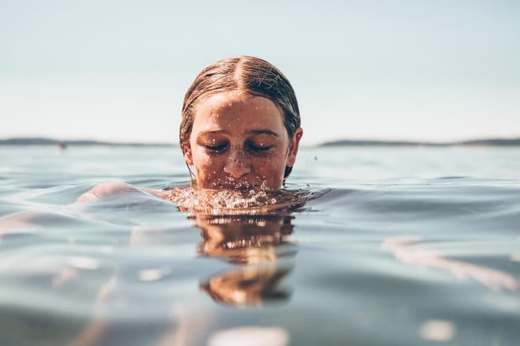 Woman swimming in water